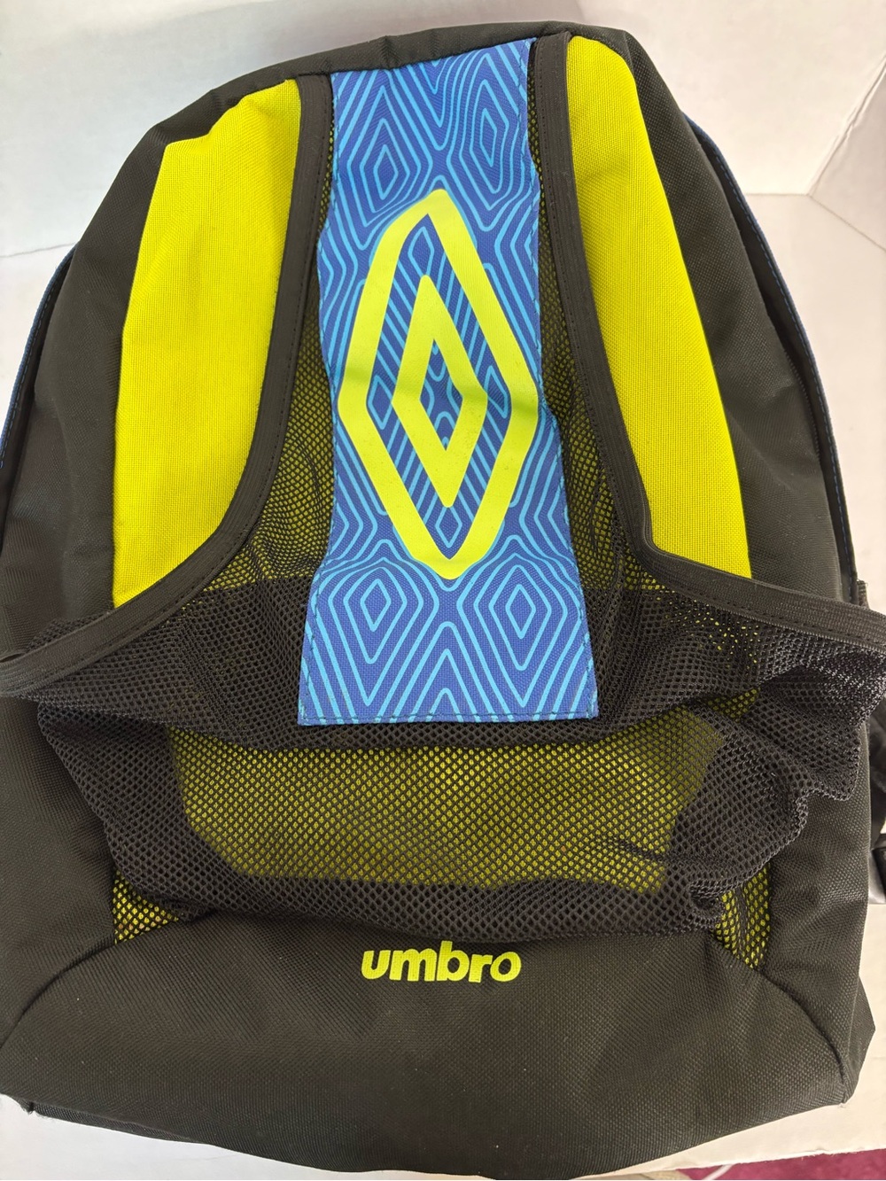 The Umbro soccer backpack features a distinctive blue diamond pattern